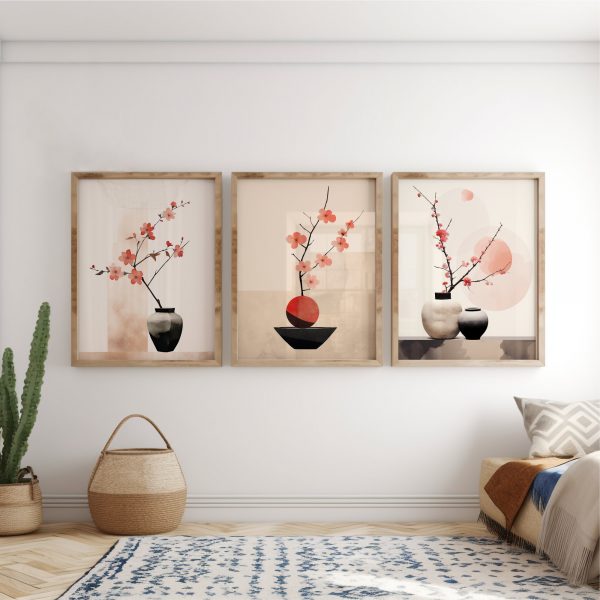 Three pictures are hanging on a wall, with a neutral pink Japanese floral design. Zen calm wall art.